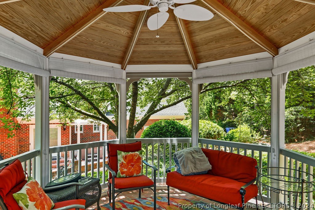 300 Shawcroft Road Fayetteville, NC 28311 - Photo 38 of 42 a roof deck with a table and chairs