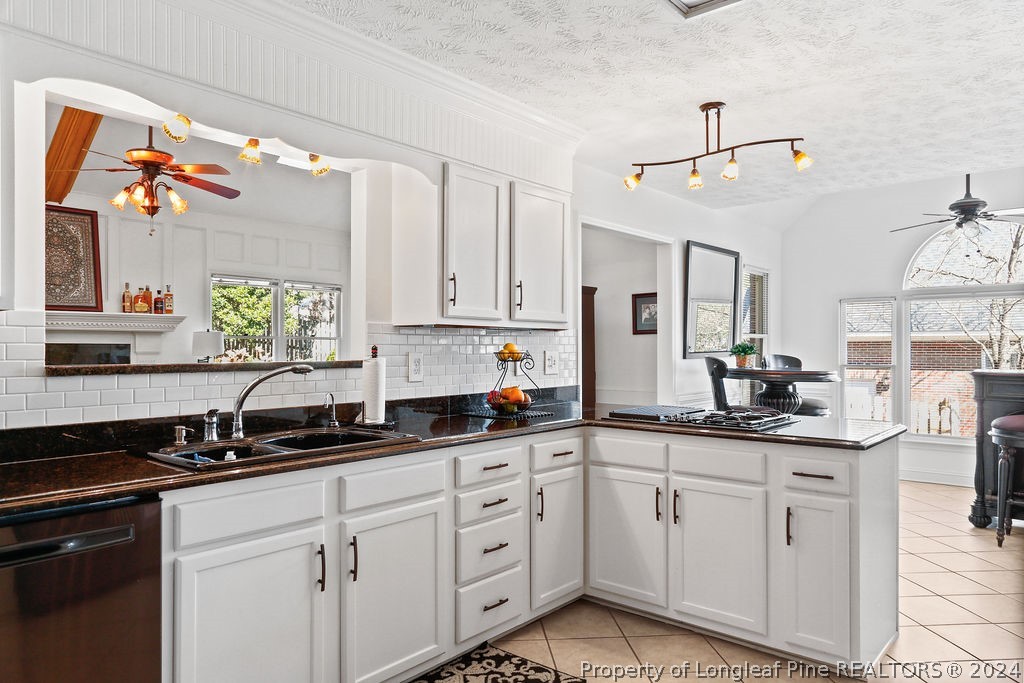 300 Shawcroft Road Fayetteville, NC 28311 - Photo 6 of 42 a kitchen with granite countertop a sink stainless steel appliances and cabinets