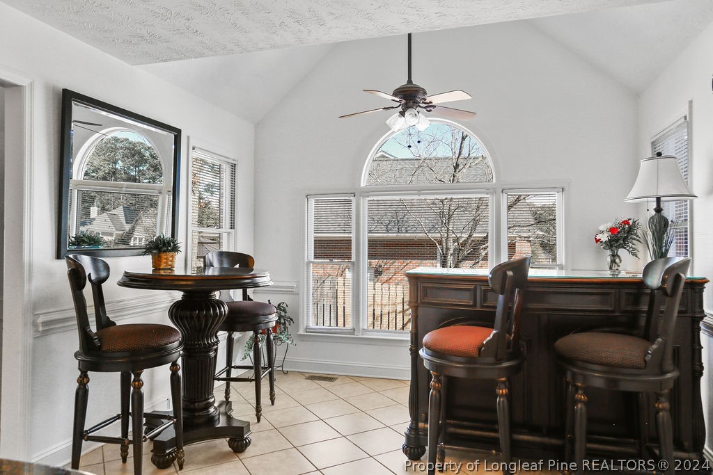 300 Shawcroft Road Fayetteville, NC 28311 - Photo 9 of 42 a dining room with furniture a chandelier and window
