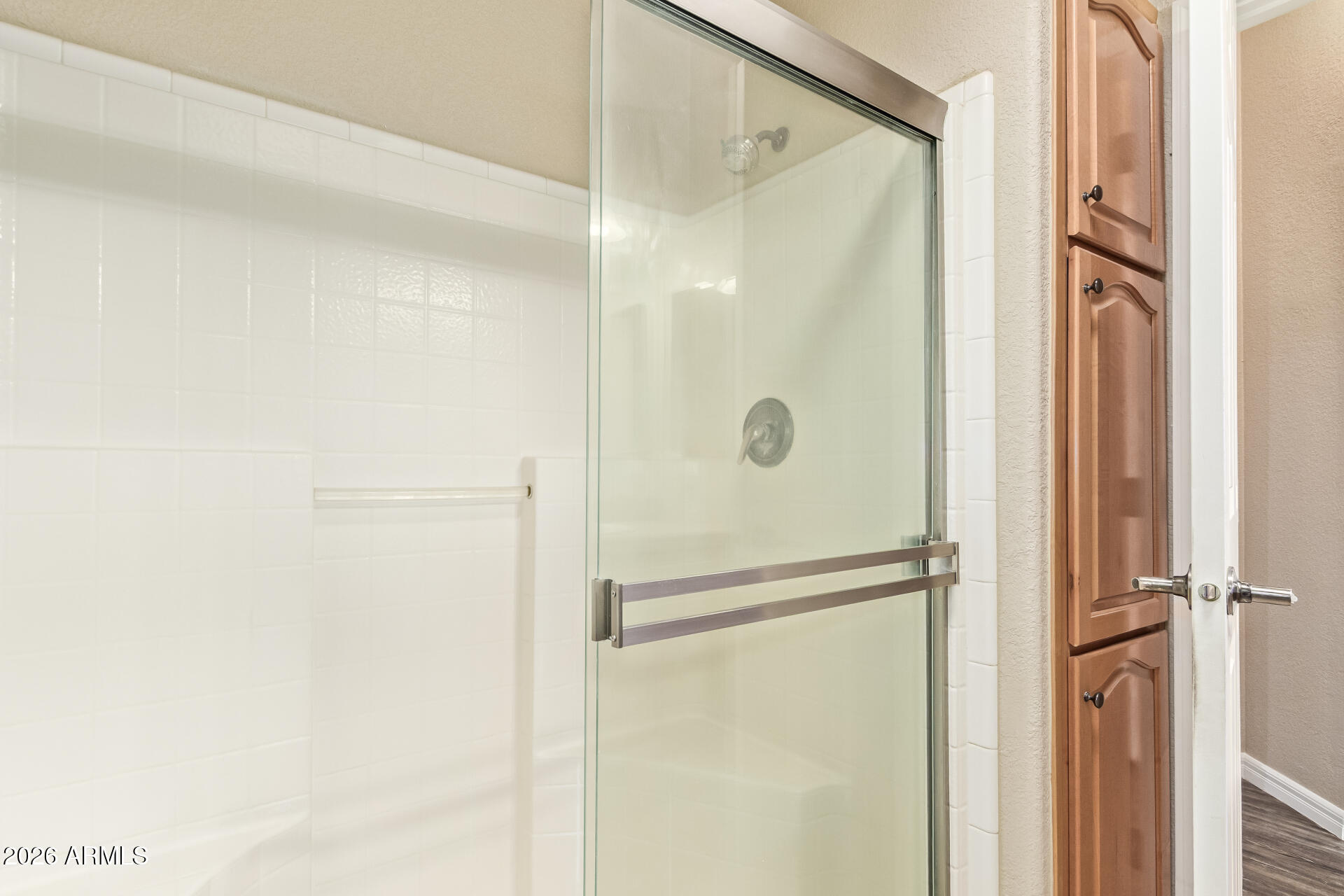 3301 South Goldfield Road, Unit 4028 Apache Junction, AZ 85119 - Photo 26 of 43 a bathroom with a glass shower door