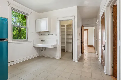 a view of a walk in closet and window