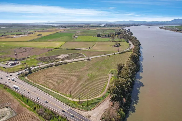 a view of a pool in a backyard of a house