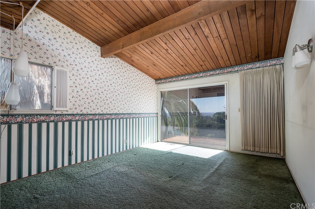 7214 Canyon Drive Whittier, CA 90602 - Photo 11 of 40 a view of backyard with small cabin and wooden fencing