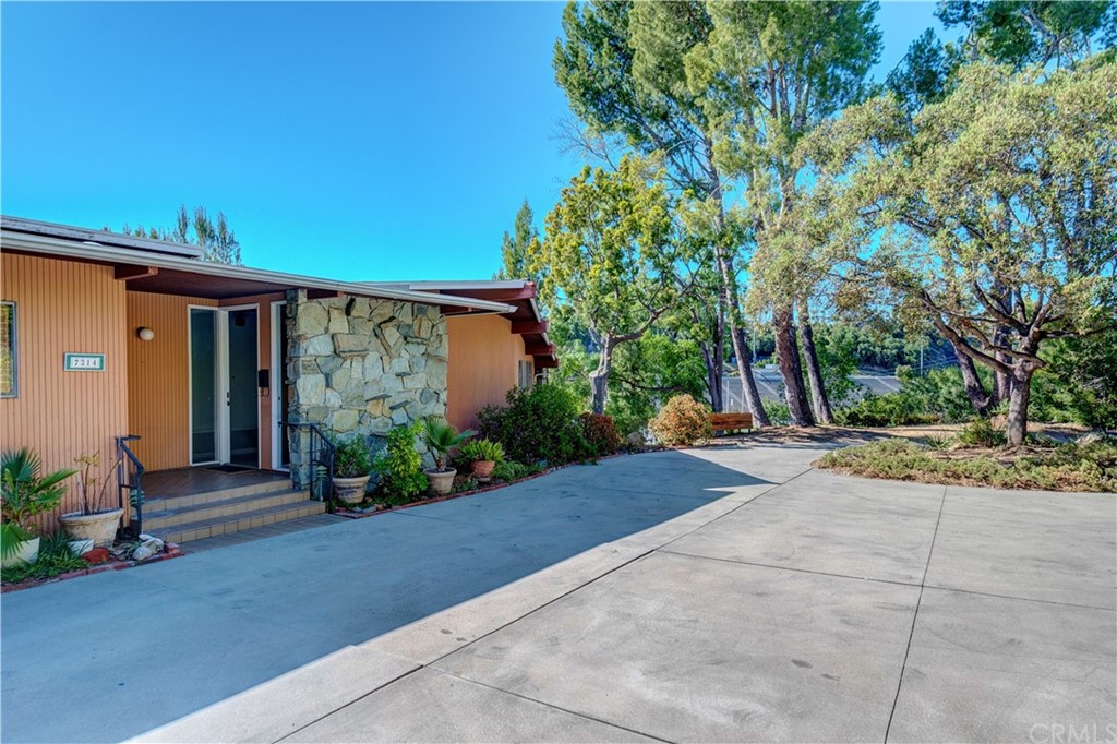 7214 Canyon Drive Whittier, CA 90602 - Photo 2 of 40 a view of a house with garden and plants