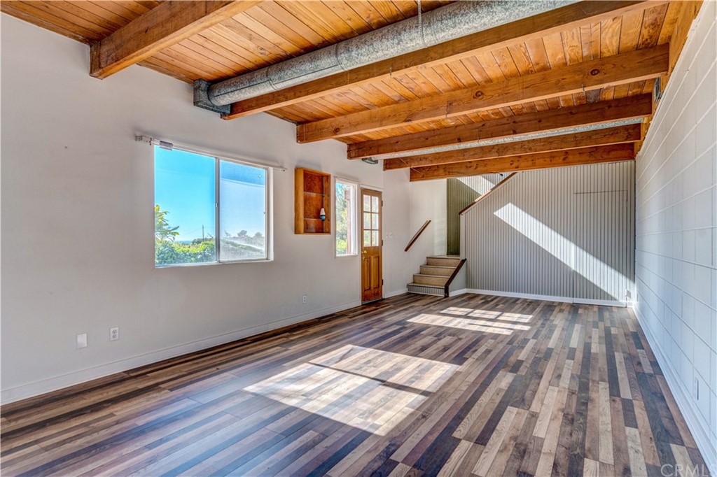 7214 Canyon Drive Whittier, CA 90602 - Photo 23 of 40 a view of a room with wooden floor and stairs