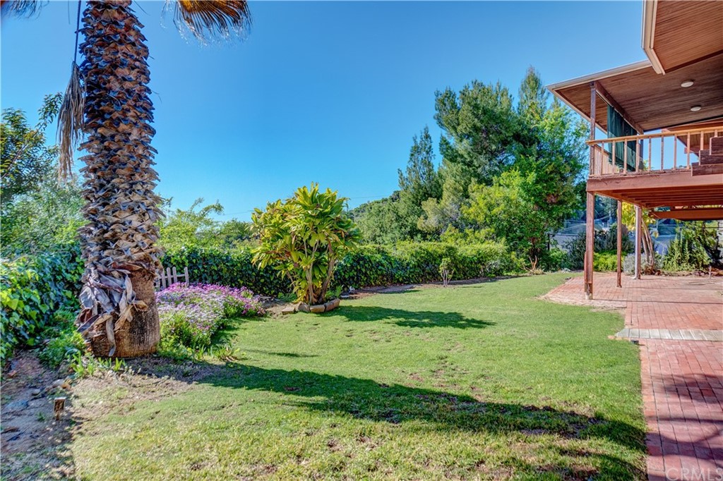 7214 Canyon Drive Whittier, CA 90602 - Photo 26 of 40 a view of a yard with plants and a fountain