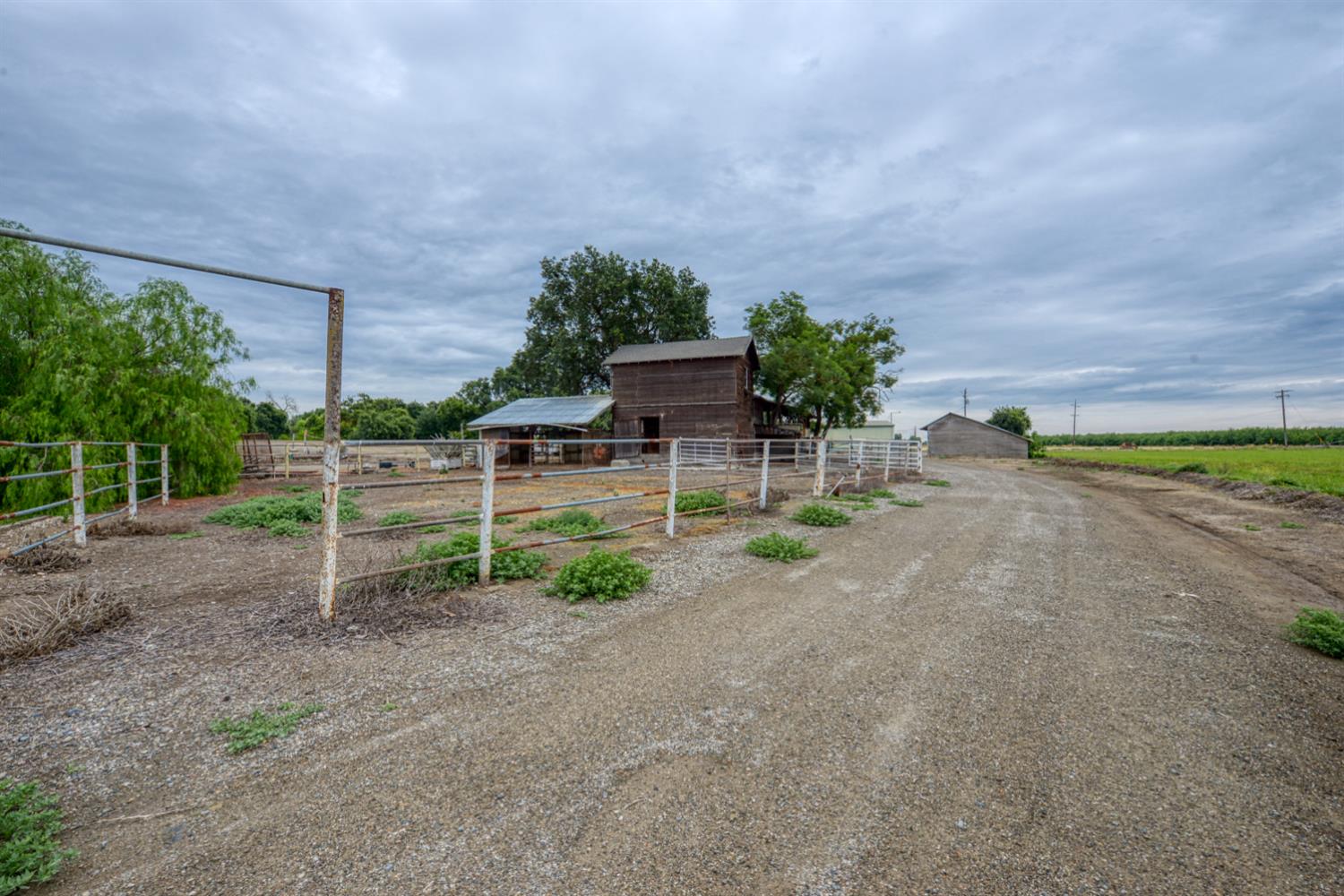 2931 East Marshall Road Patterson, CA 95363 - Photo 36 of 54 Road to barn and Shop