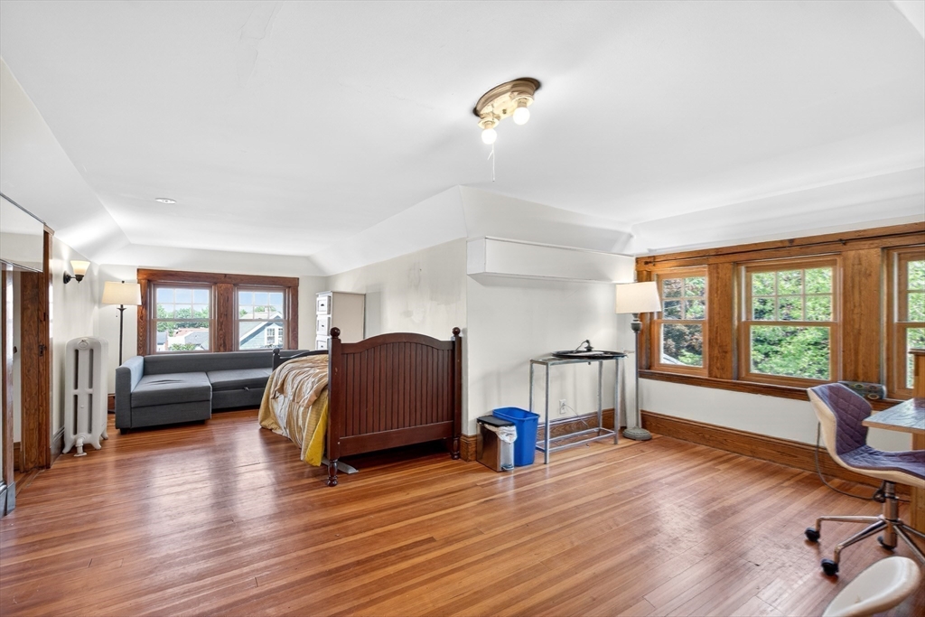 76-78 Lewis Road Belmont, MA 02478 - Photo 32 of 36 a living room with furniture and a wooden floor