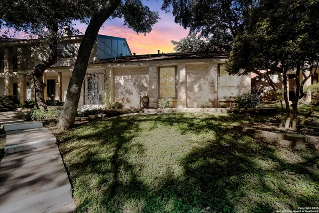 a backyard of a house with lots of green space