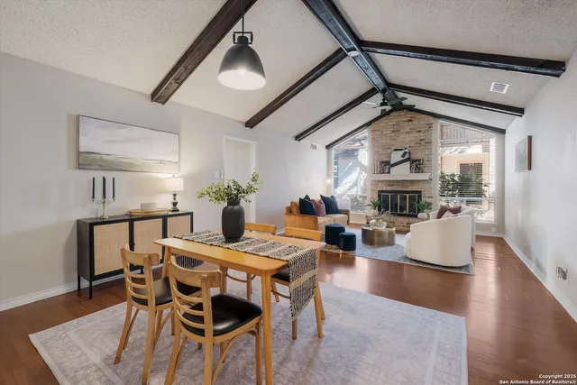 a view of a dining room with furniture and wooden floor