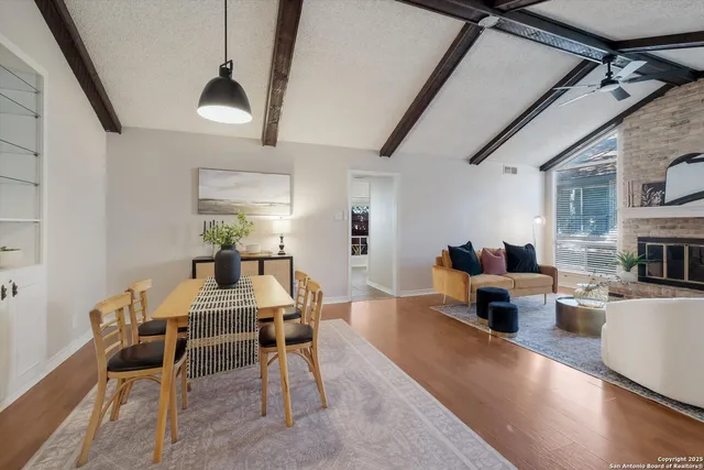 a view of a dining room with furniture window and wooden floor