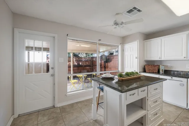 a kitchen that has a cabinets and a stove