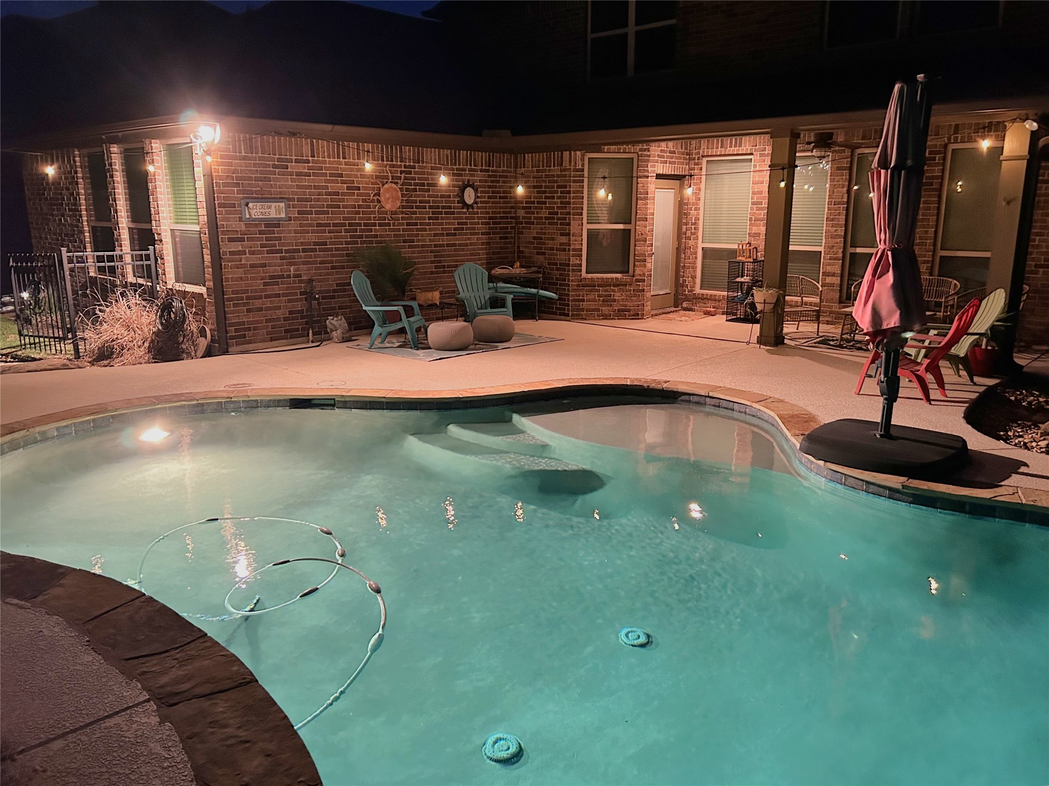 2205 Ralston Creek Court Brenham, TX 77833 - Photo 23 of 37 a swimming pool with outdoor seating and yard