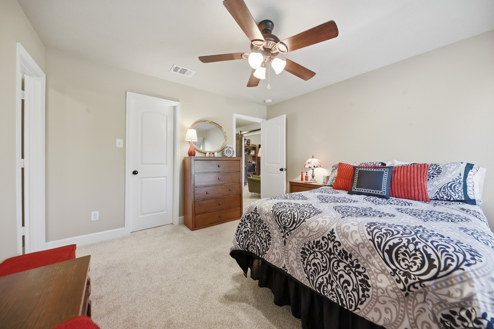 2205 Ralston Creek Court Brenham, TX 77833 - Photo 28 of 37 a spacious bedroom with a bed and a chandelier
