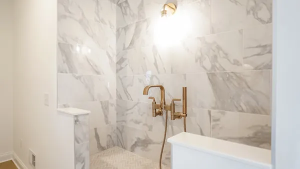a bathroom with a bathtub and shower