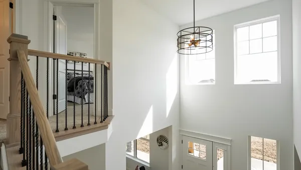 a view of a hallway with windows