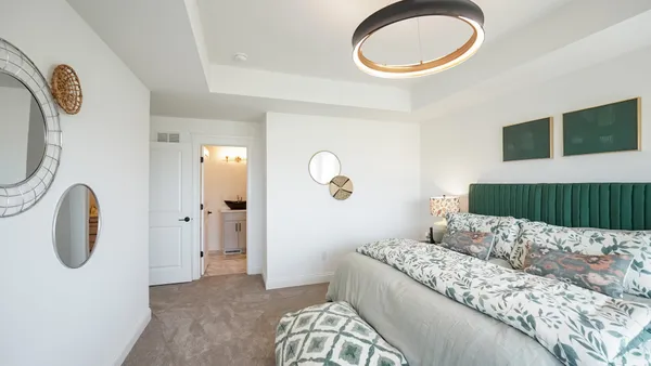 a bedroom with a bed and a chair