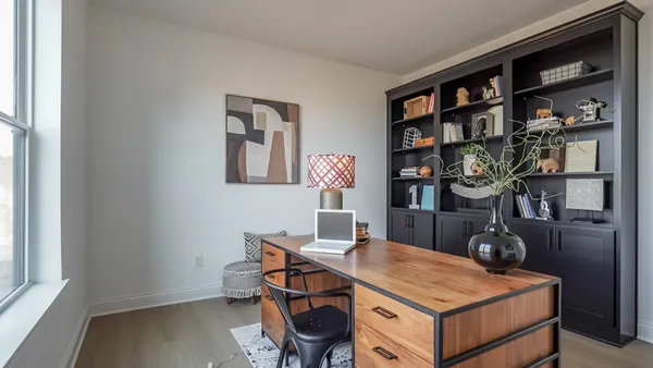 a view of a workspace with furniture