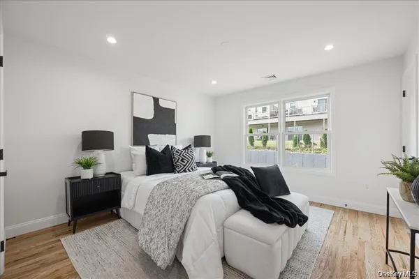 a bed room with bed and a window