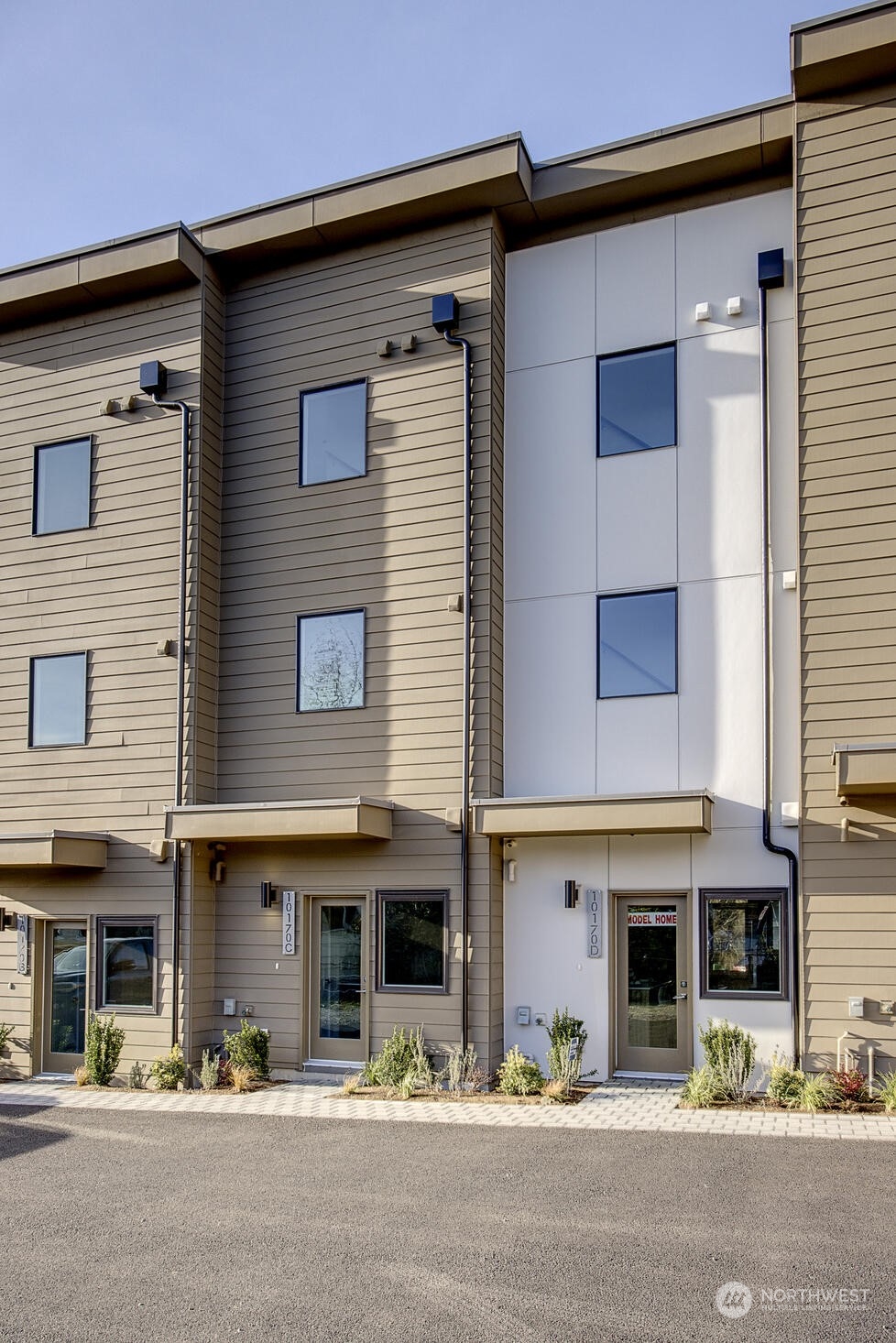 10170 Holman Road Northwest, Unit E Seattle, WA 98133 - Photo 1 of 12 a view of a building with street