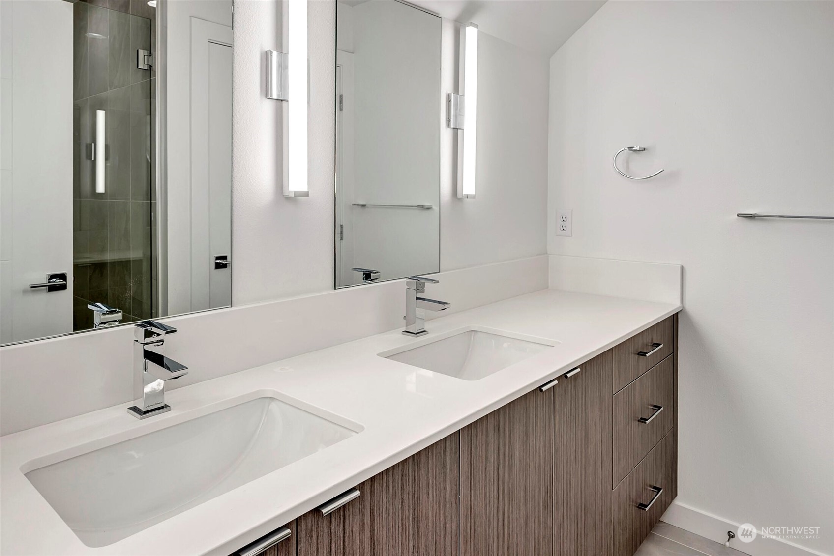 10170 Holman Road Northwest, Unit E Seattle, WA 98133 - Photo 8 of 12 a bathroom with a sink and a mirror
