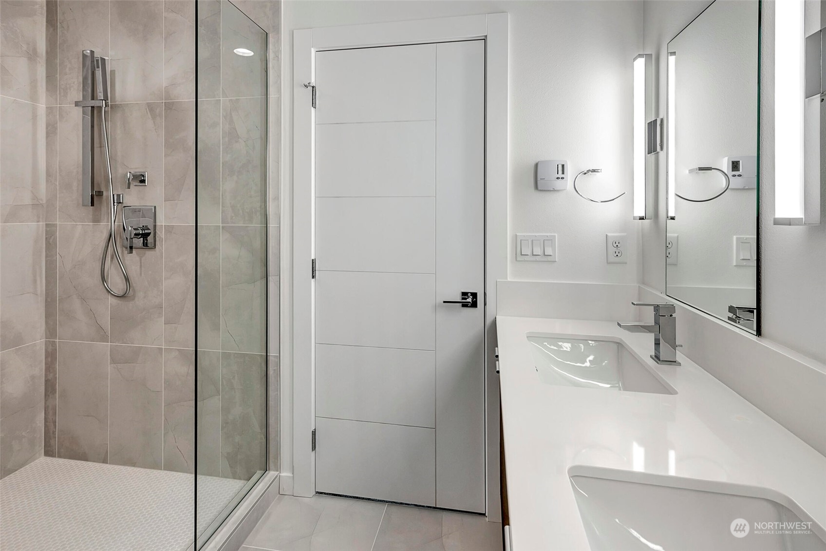 10170 Holman Road Northwest, Unit E Seattle, WA 98133 - Photo 9 of 12 a bathroom with a shower and a sink