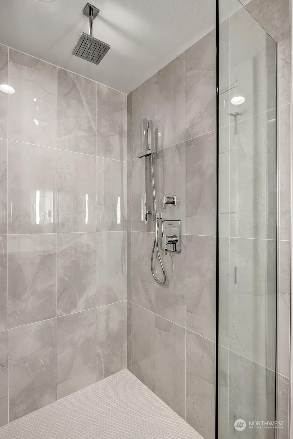 10170 Holman Road Northwest, Unit E Seattle, WA 98133 - Photo 10 of 12 a bathroom with a shower