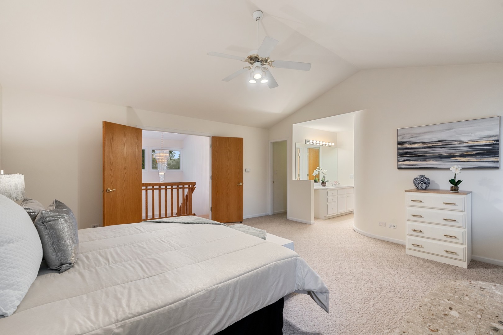 336 Beverly Drive Wilmette, IL 60091 - Photo 16 of 34 a bedroom with a bed and a chandelier