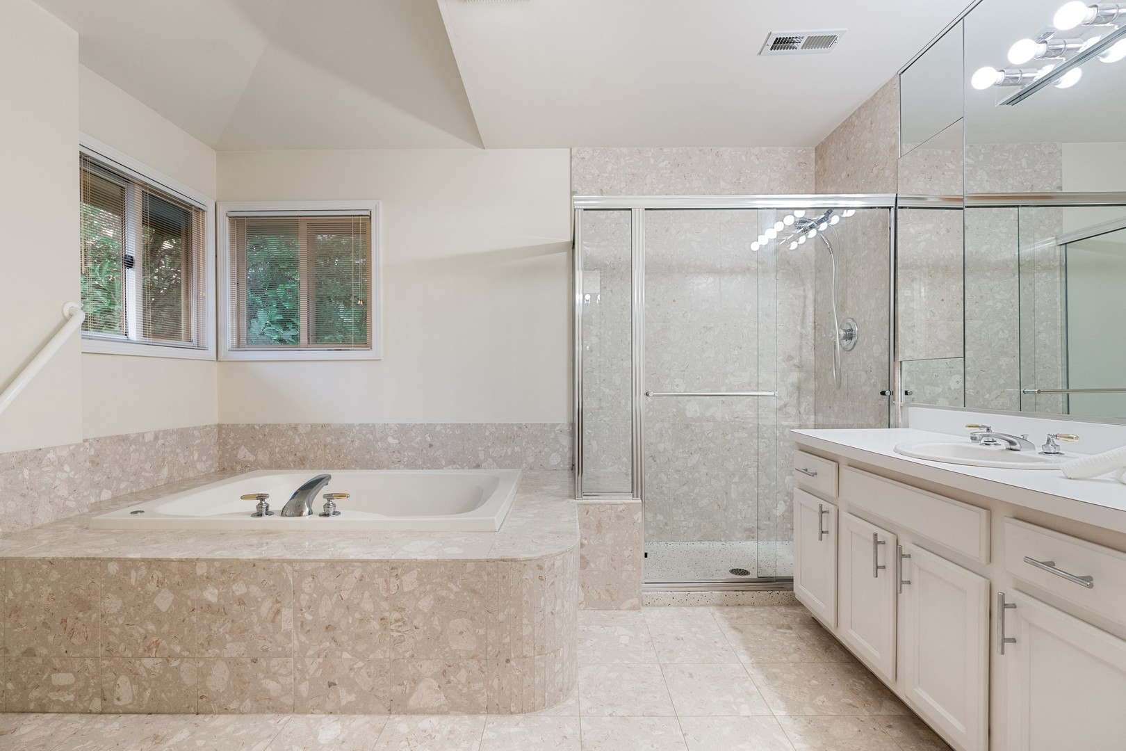 336 Beverly Drive Wilmette, IL 60091 - Photo 18 of 34 a bathroom with a tub sink and mirror