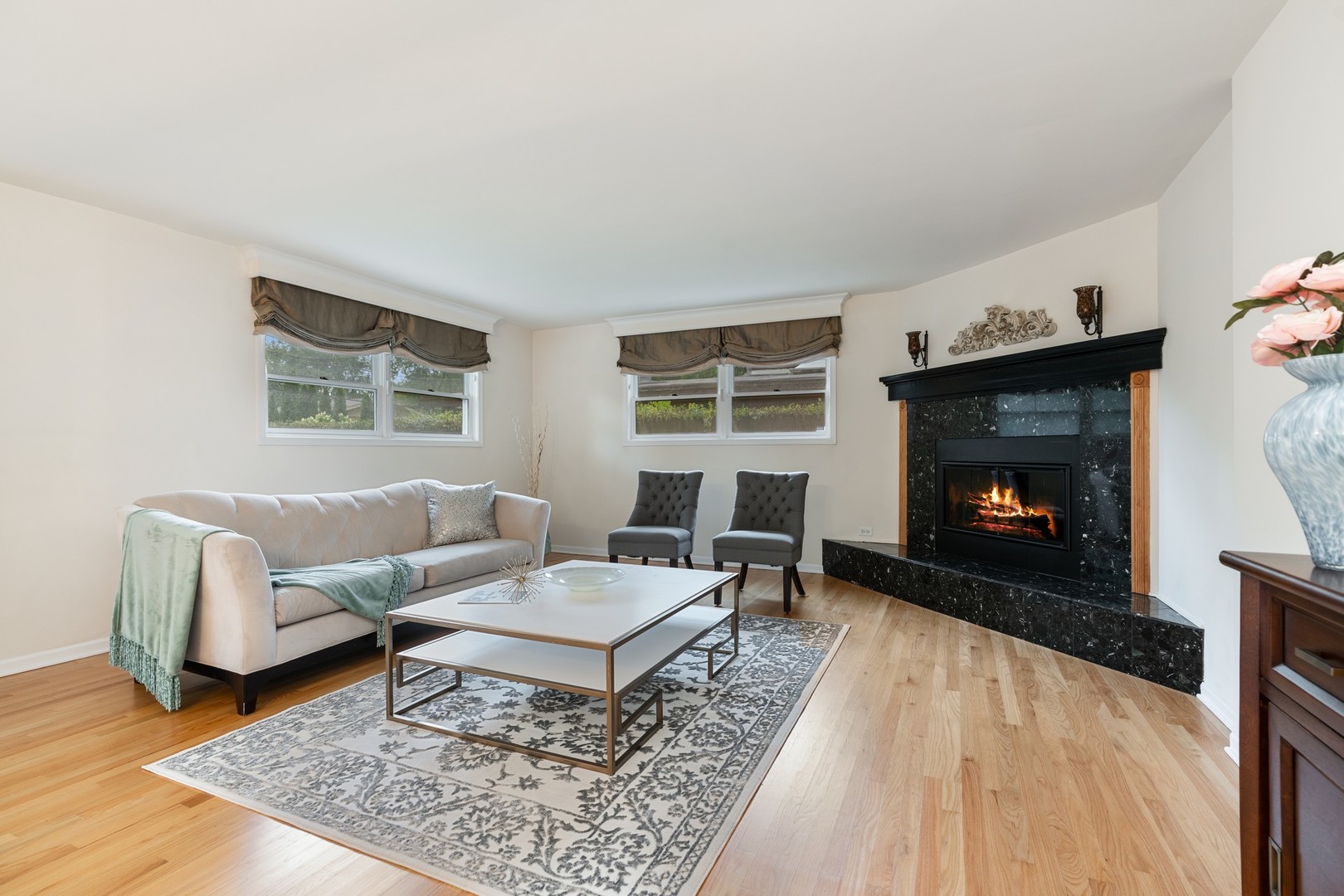 336 Beverly Drive Wilmette, IL 60091 - Photo 3 of 34 a living room with furniture and a fireplace