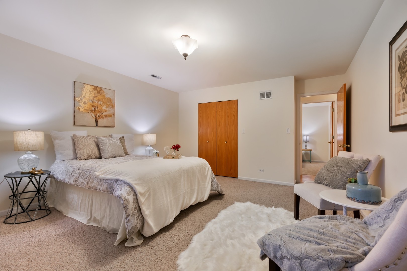 336 Beverly Drive Wilmette, IL 60091 - Photo 22 of 34 a spacious bedroom with a bed and window