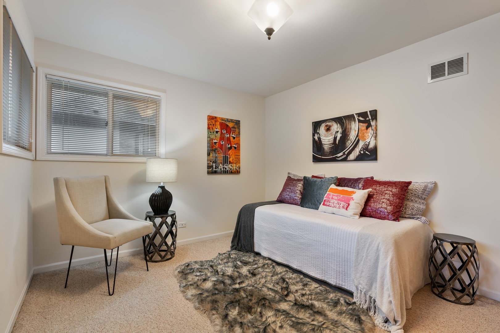 336 Beverly Drive Wilmette, IL 60091 - Photo 23 of 34 a bedroom with a bed and a couch