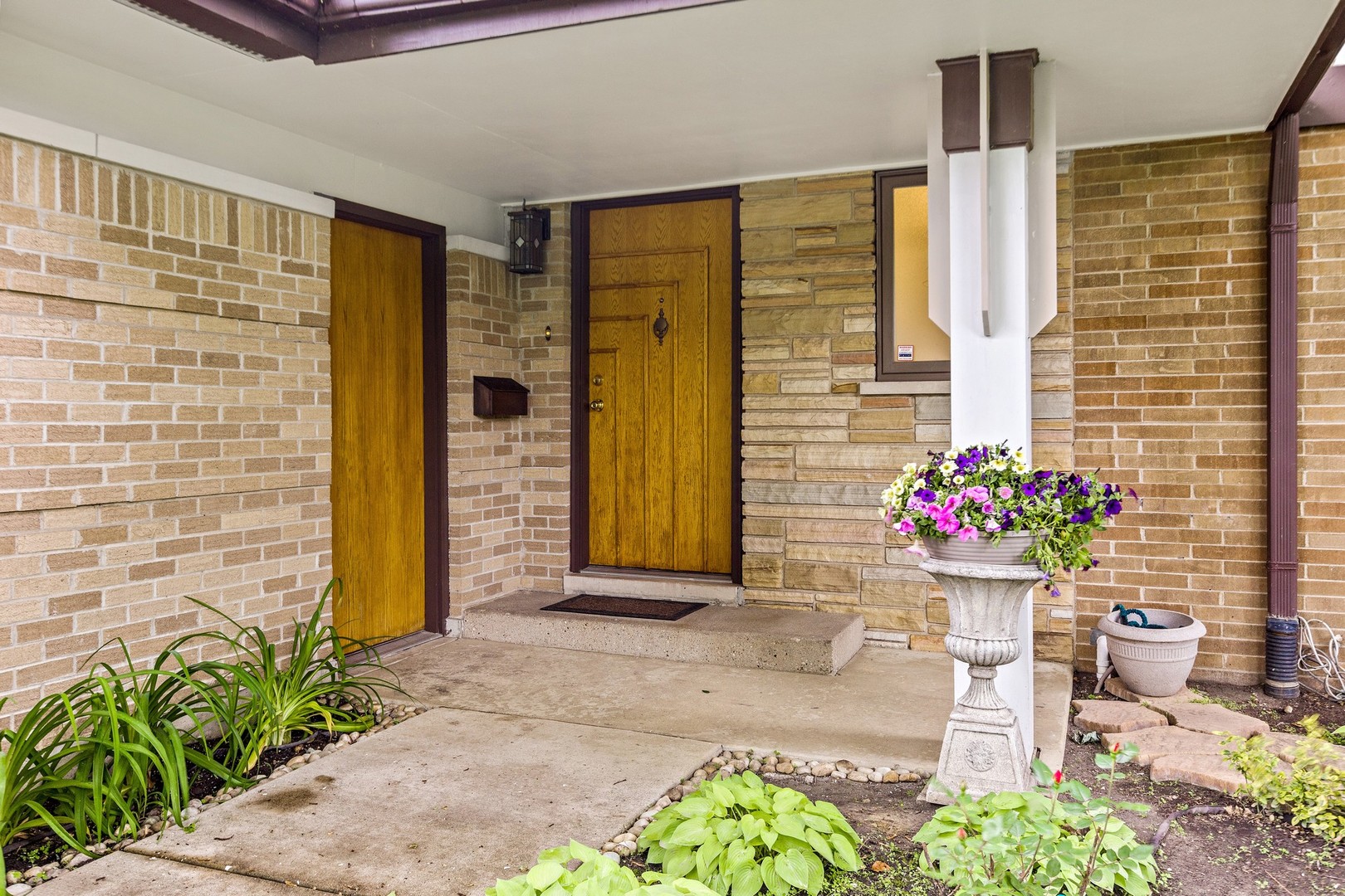 336 Beverly Drive Wilmette, IL 60091 - Photo 30 of 34 a front view of a house with flower pots