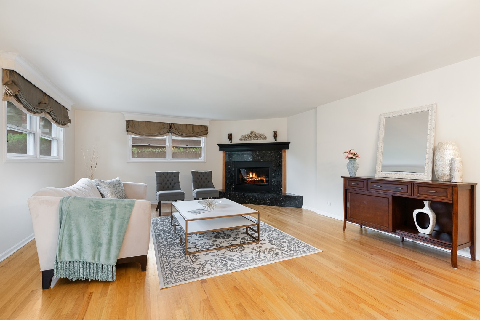 336 Beverly Drive Wilmette, IL 60091 - Photo 4 of 34 a living room with furniture and a fireplace