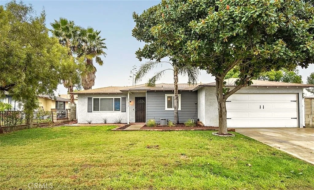 11972 Norwick Street Rancho Cucamonga, CA 91739 - Photo 1 of 1 a front view of house with yard and trees around