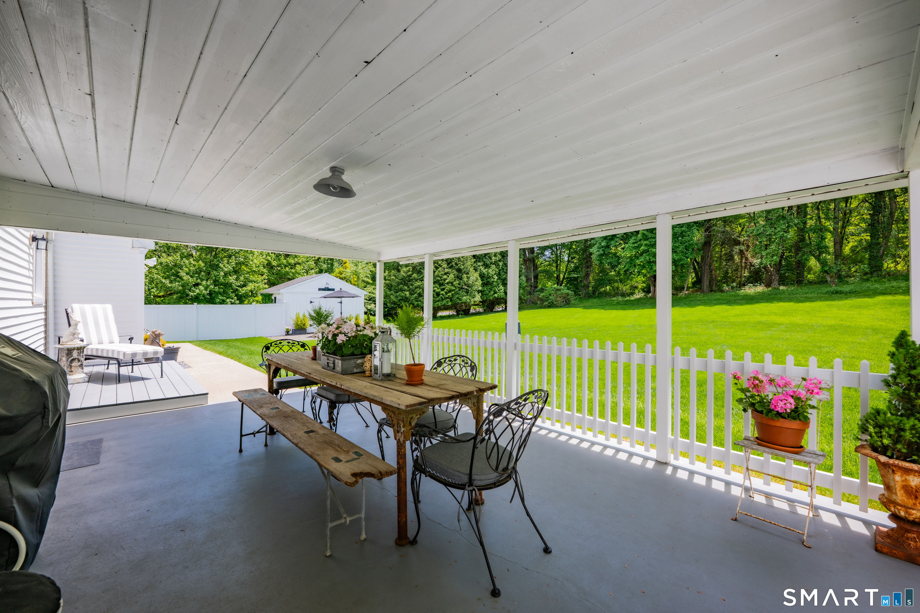 1000 Bassett Road Watertown, CT 06795 - Photo 28 of 35 a view of a patio with a table chairs and a yard