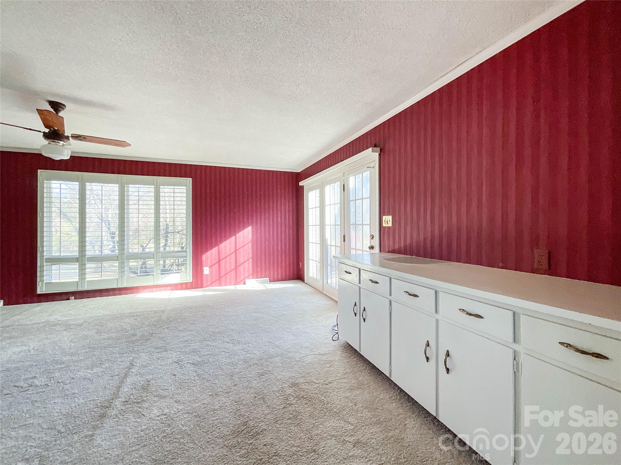 13909 Idlewild Road Matthews, NC 28105 - Photo 11 of 48 a view of an empty room with a window