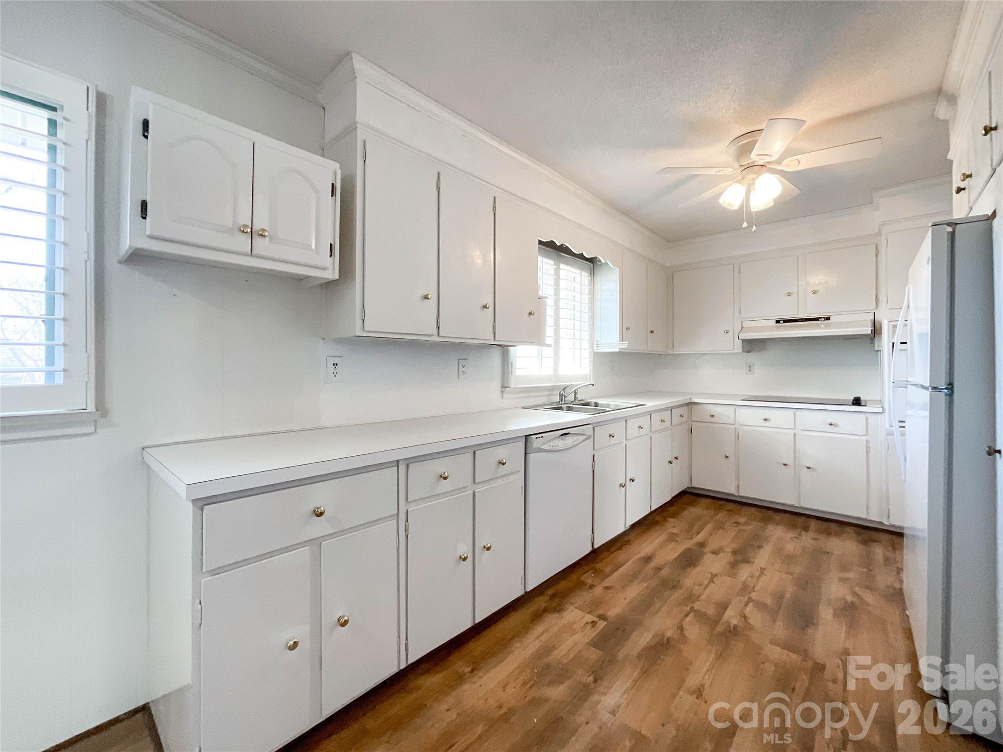 13909 Idlewild Road Matthews, NC 28105 - Photo 15 of 48 a large kitchen with cabinets