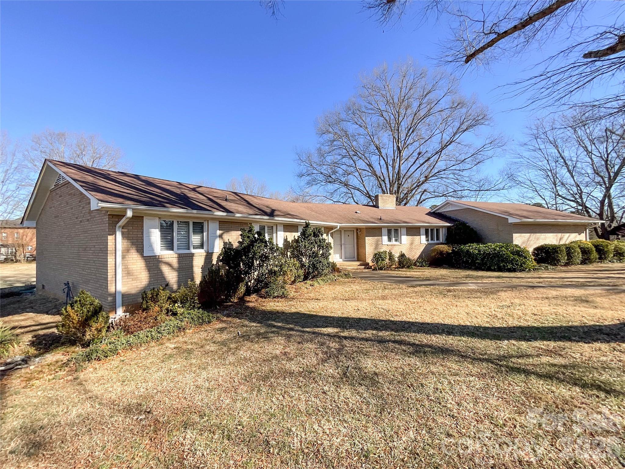 13909 Idlewild Road Matthews, NC 28105 - Photo 2 of 48 a view of a house with a yard covered in snow