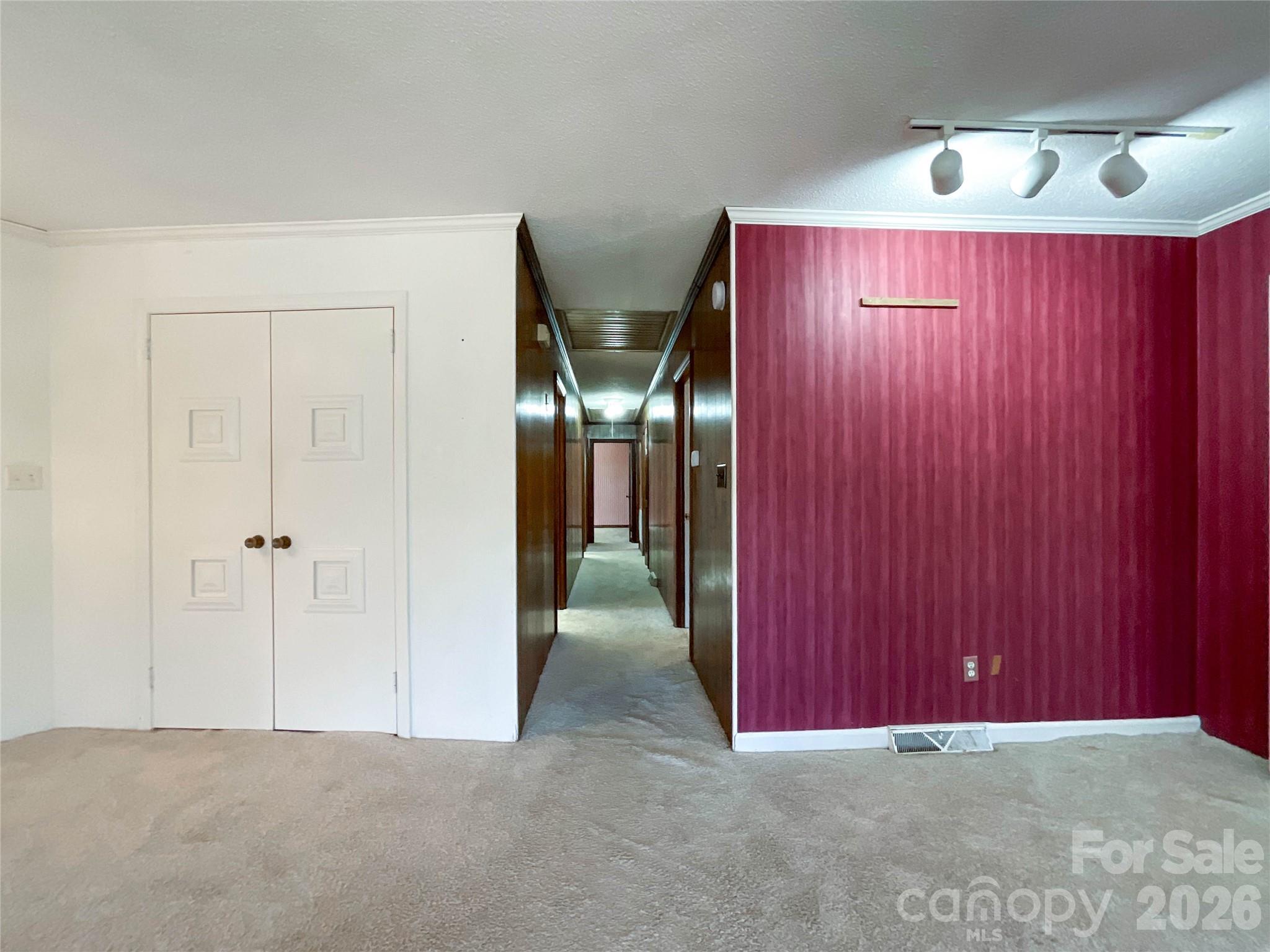 13909 Idlewild Road Matthews, NC 28105 - Photo 21 of 48 an empty room with windows and closet