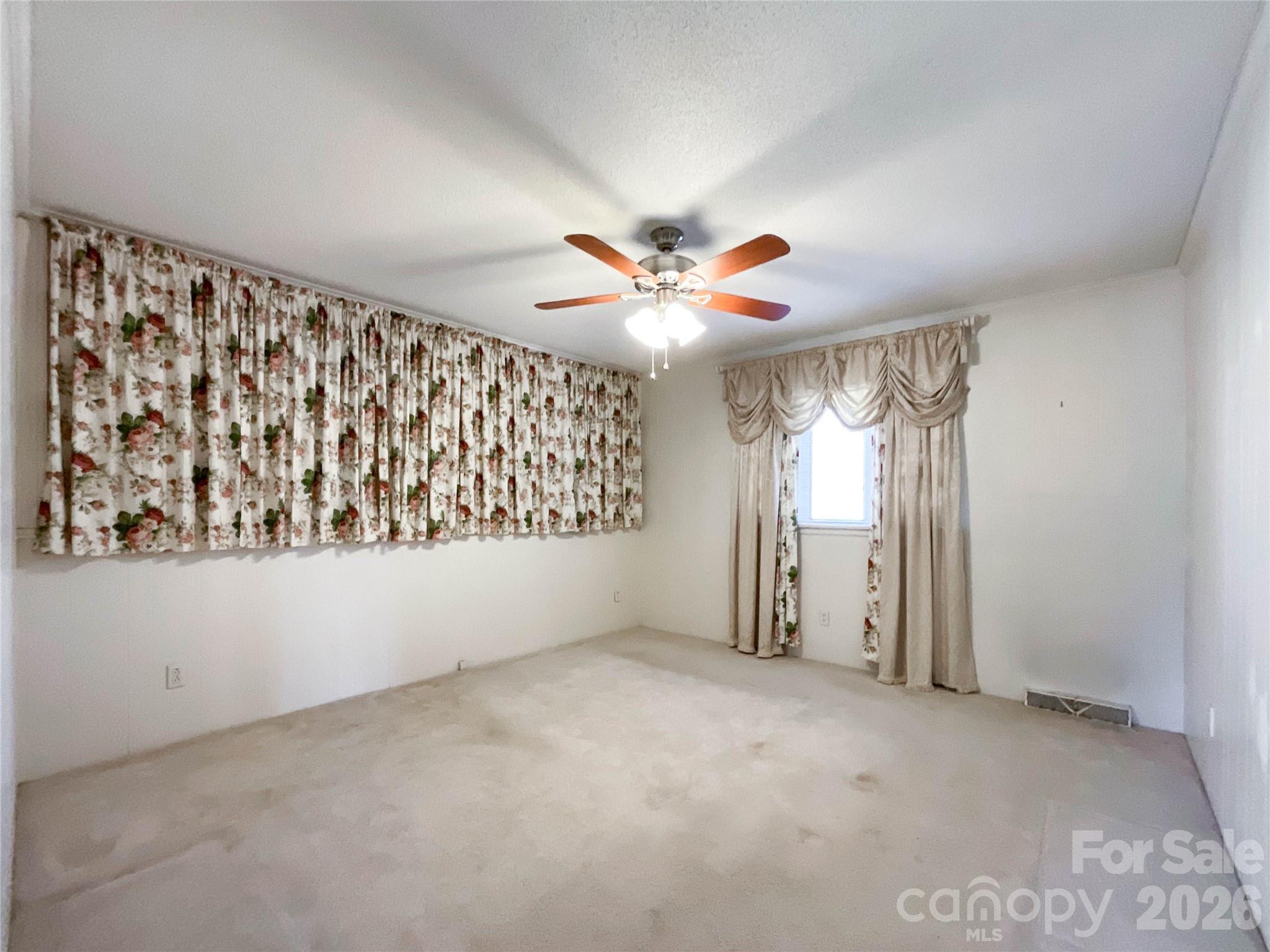13909 Idlewild Road Matthews, NC 28105 - Photo 22 of 48 a view of an empty room with a window
