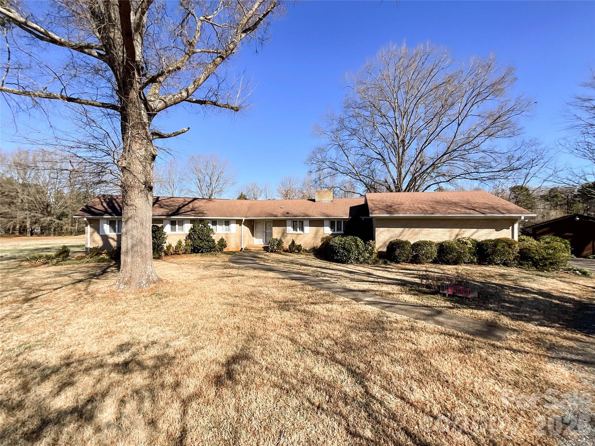 13909 Idlewild Road Matthews, NC 28105 - Photo 3 of 48 a view of a town with large trees