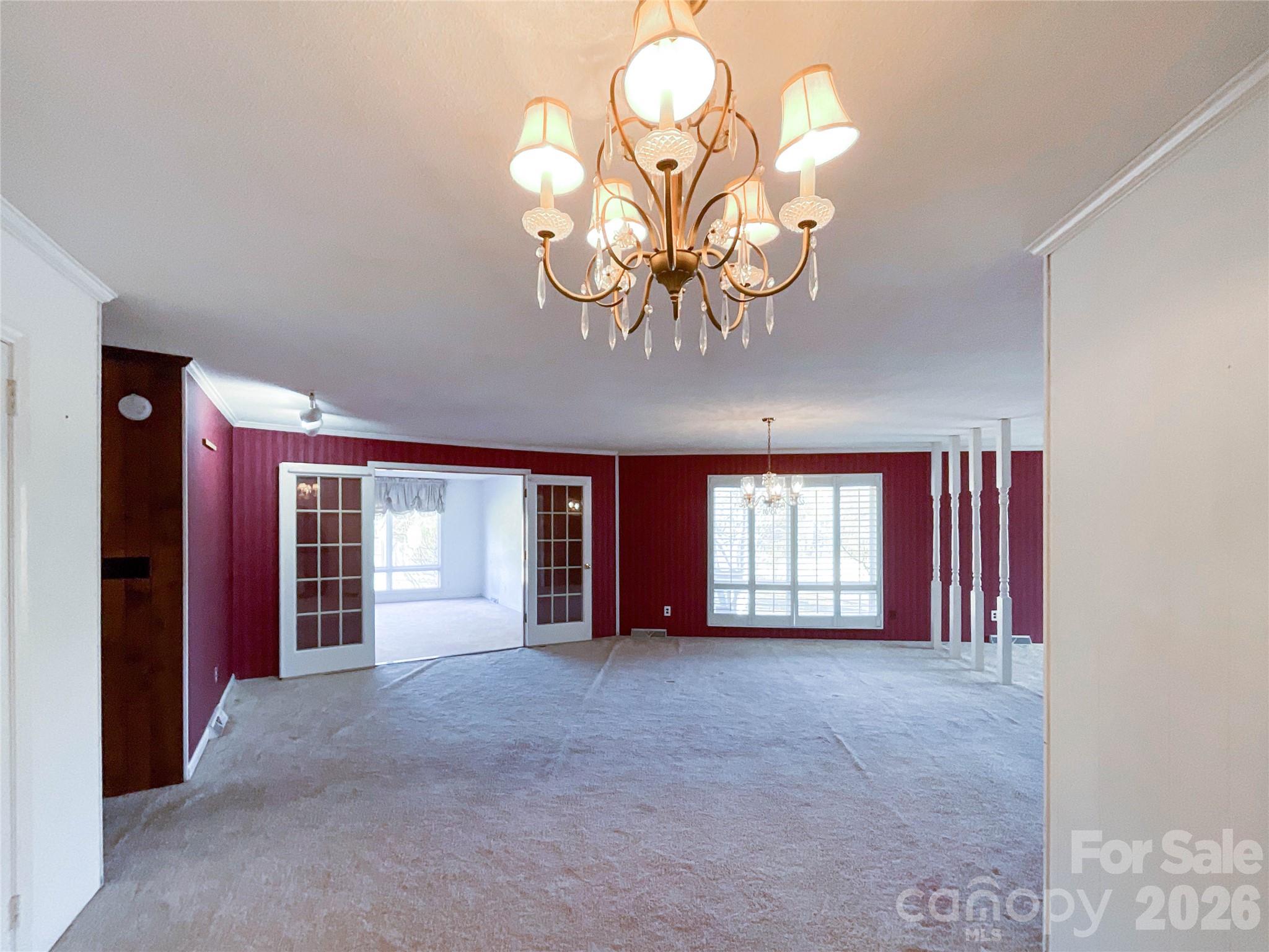 13909 Idlewild Road Matthews, NC 28105 - Photo 4 of 48 a view of a livingroom with a chandelier