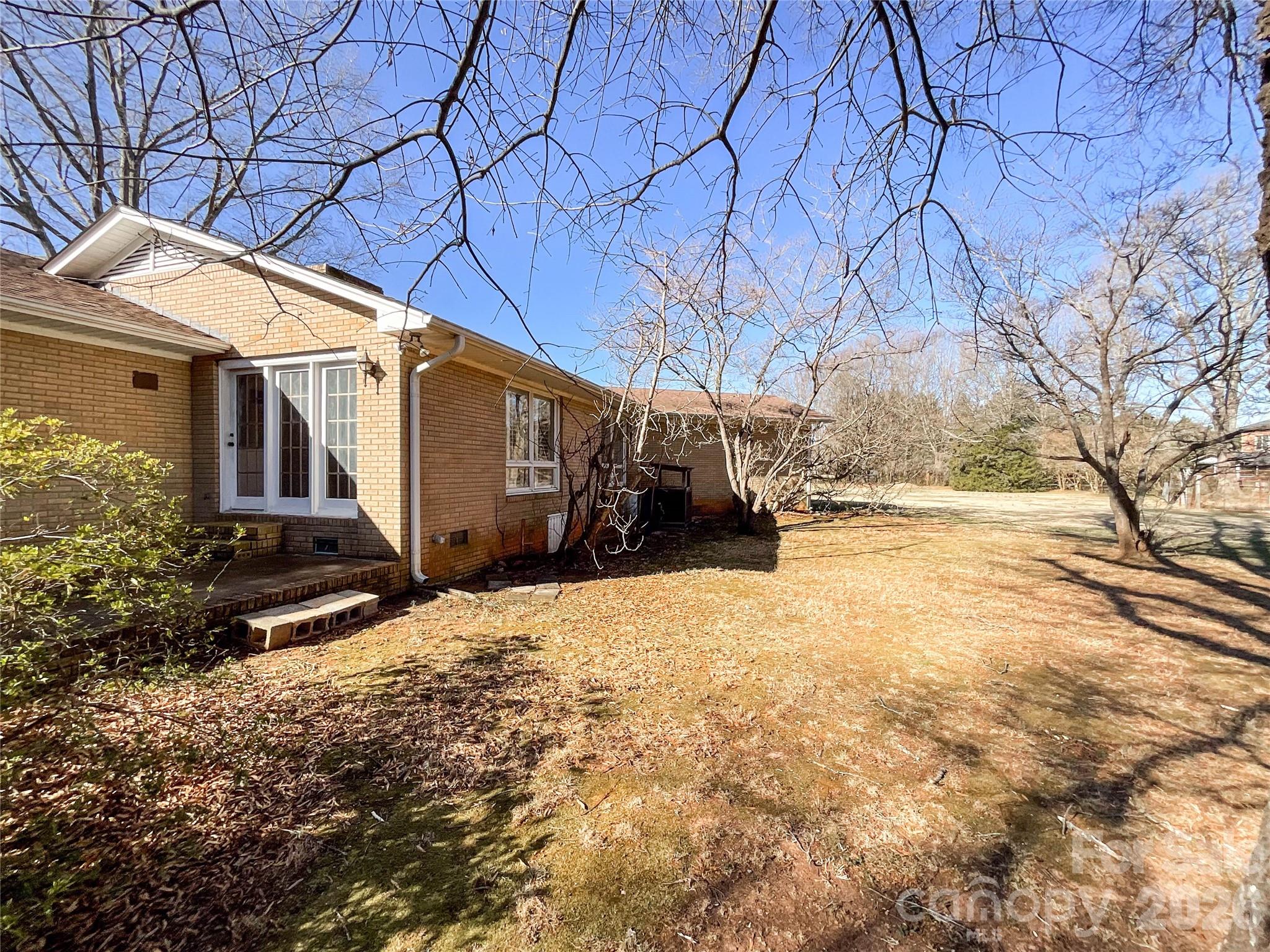 13909 Idlewild Road Matthews, NC 28105 - Photo 44 of 48 a view of a house with snow on the road