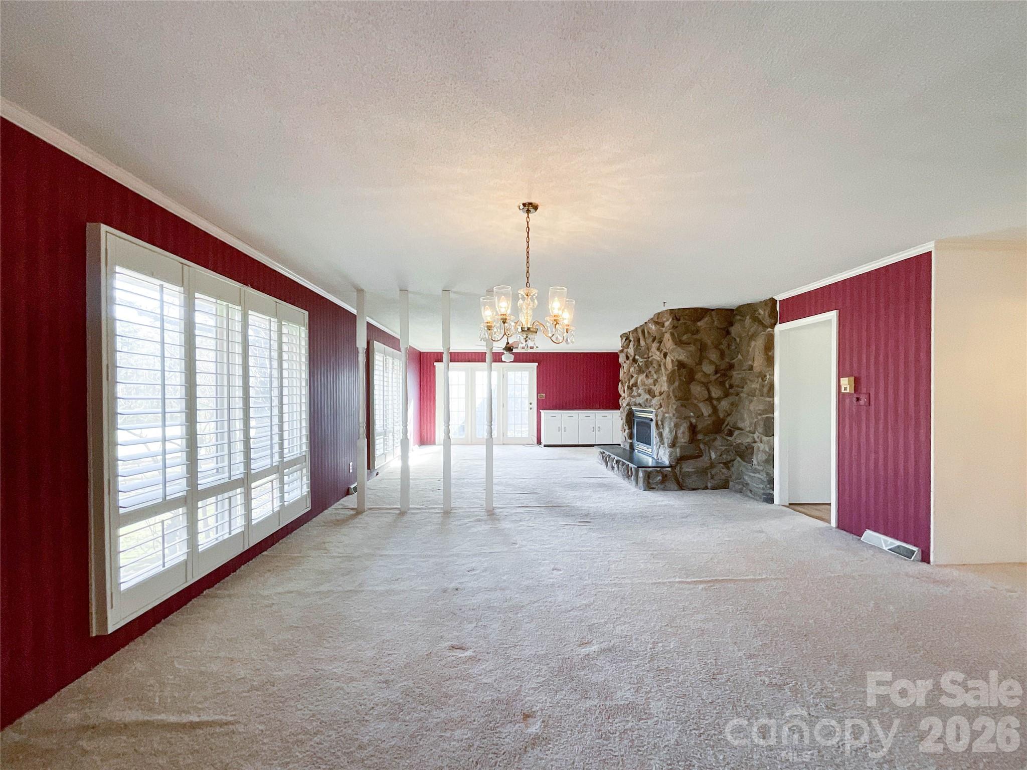 13909 Idlewild Road Matthews, NC 28105 - Photo 6 of 48 a view of a livingroom with a chandelier