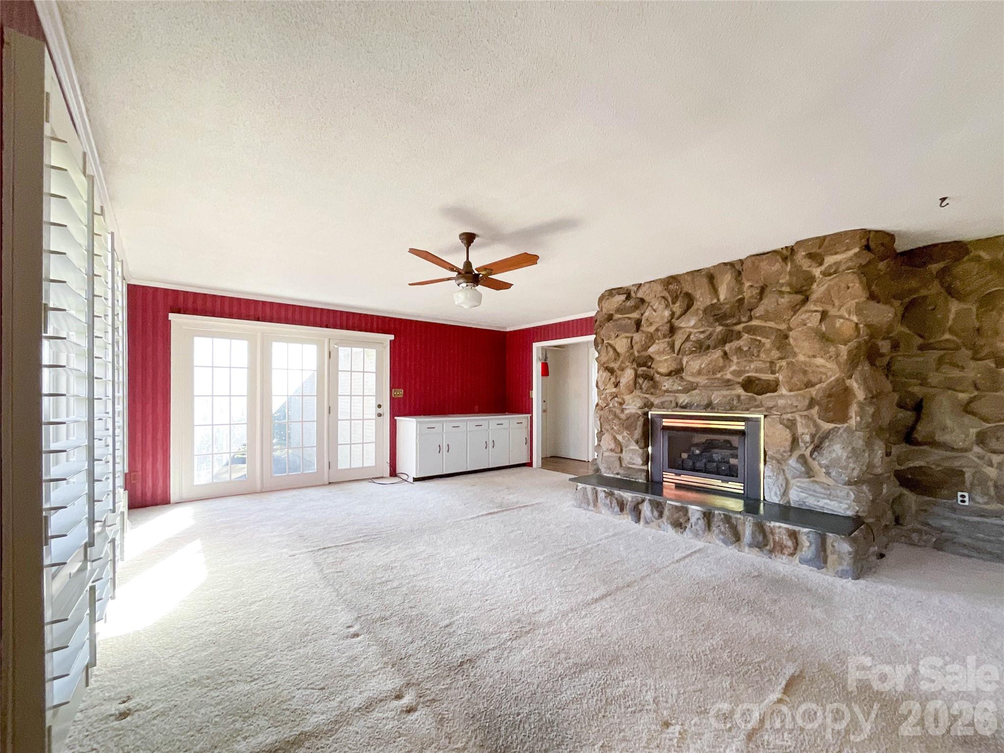 13909 Idlewild Road Matthews, NC 28105 - Photo 7 of 48 a living room with furniture and a fireplace