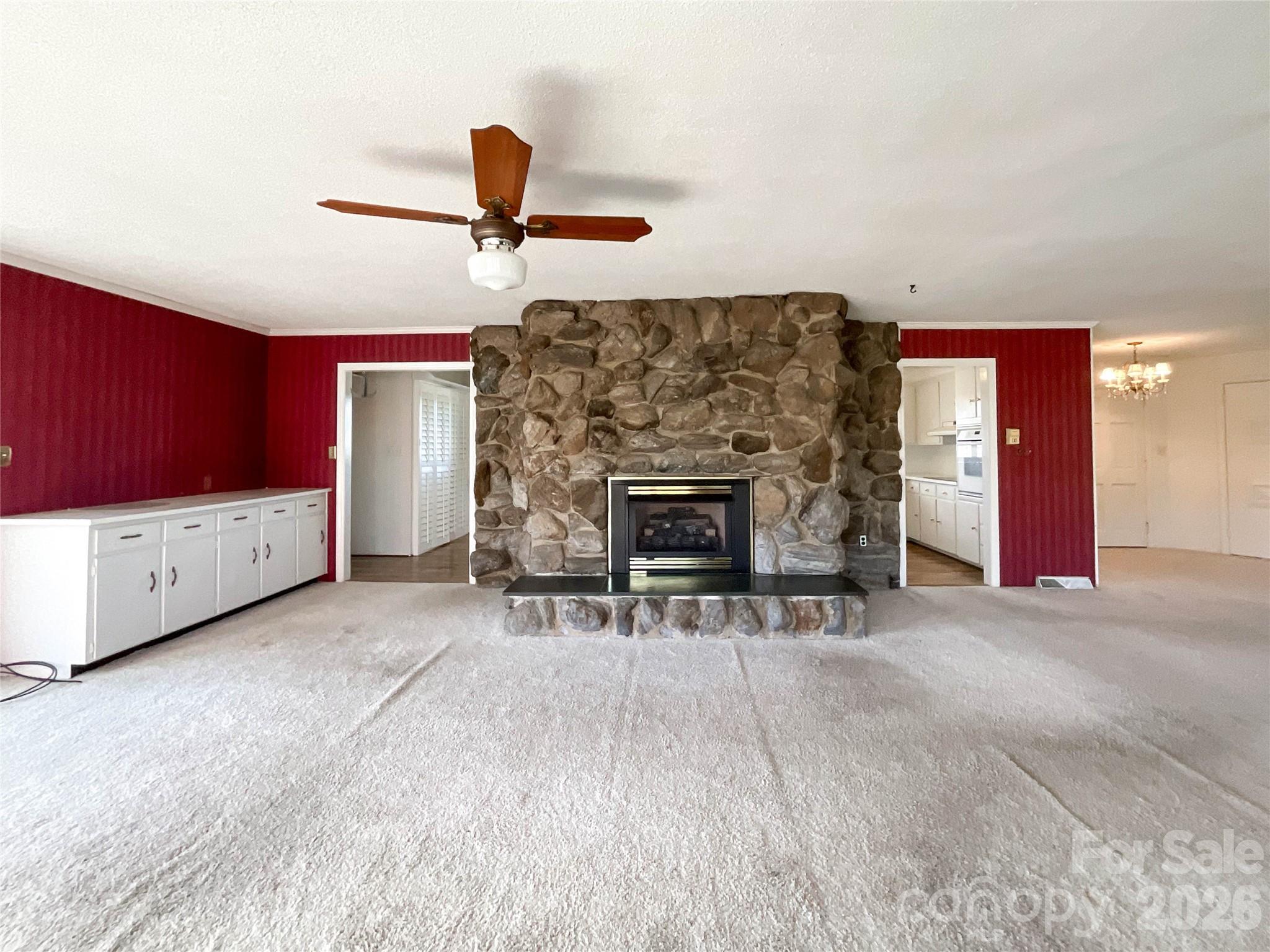 13909 Idlewild Road Matthews, NC 28105 - Photo 8 of 48 a living room with furniture and a fireplace