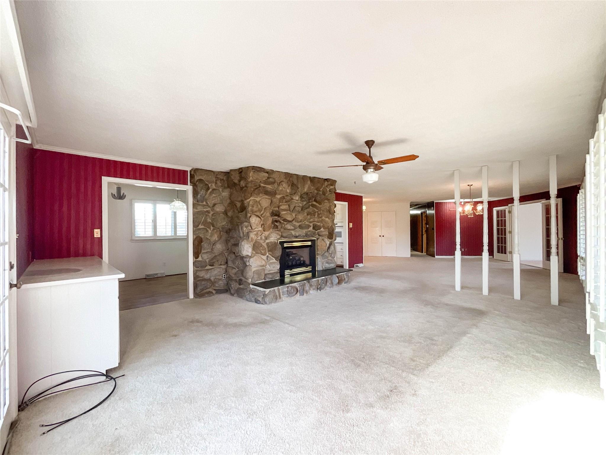 13909 Idlewild Road Matthews, NC 28105 - Photo 9 of 48 a view of a livingroom with a fireplace