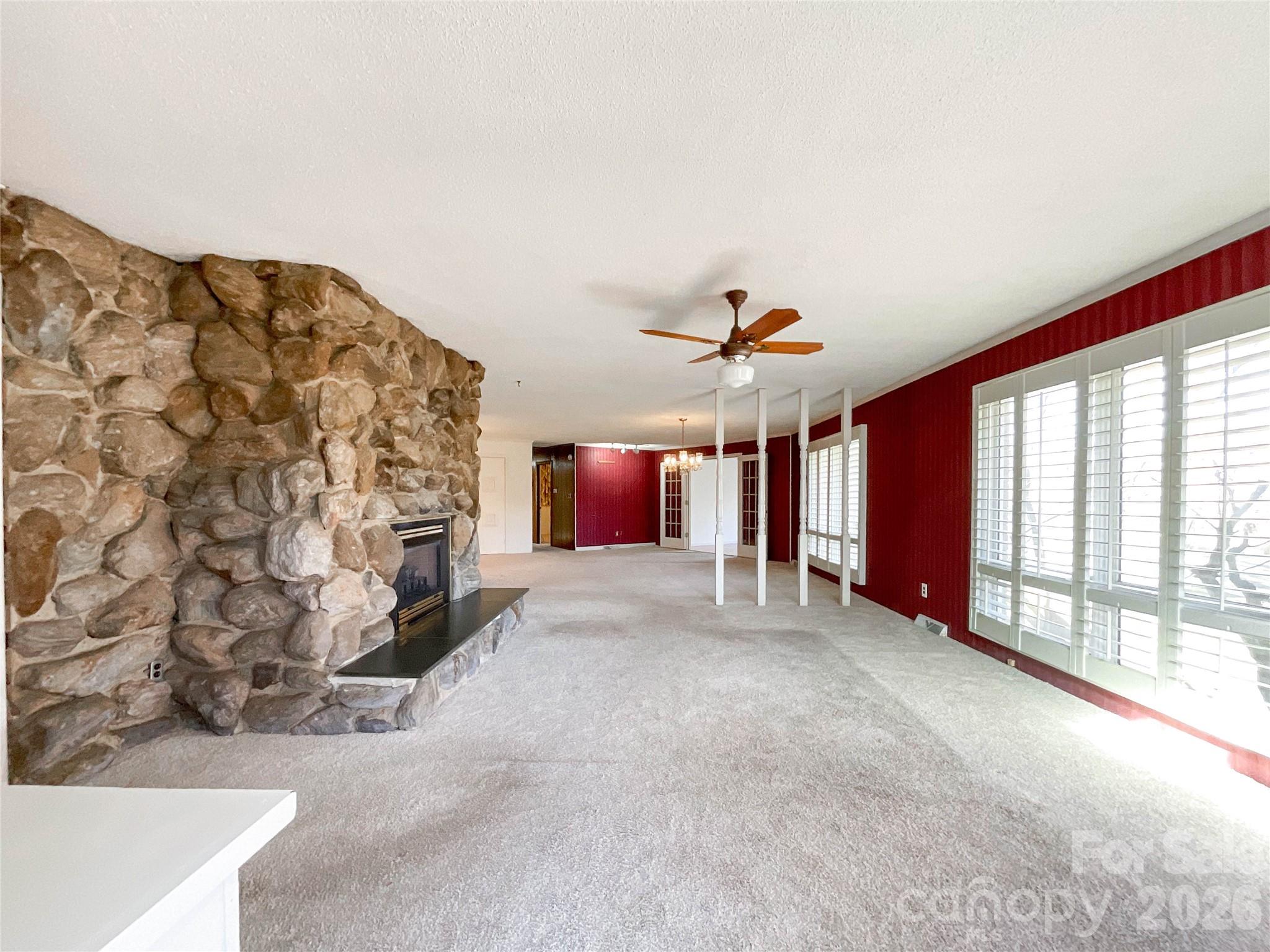 13909 Idlewild Road Matthews, NC 28105 - Photo 10 of 48 a big room with windows and fireplace