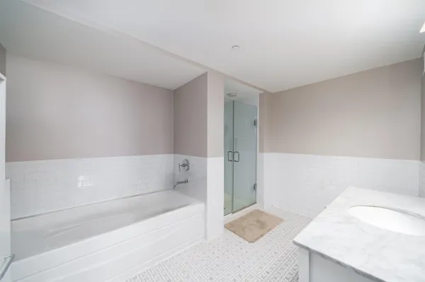 a bedroom with a bed gym equipment and a window